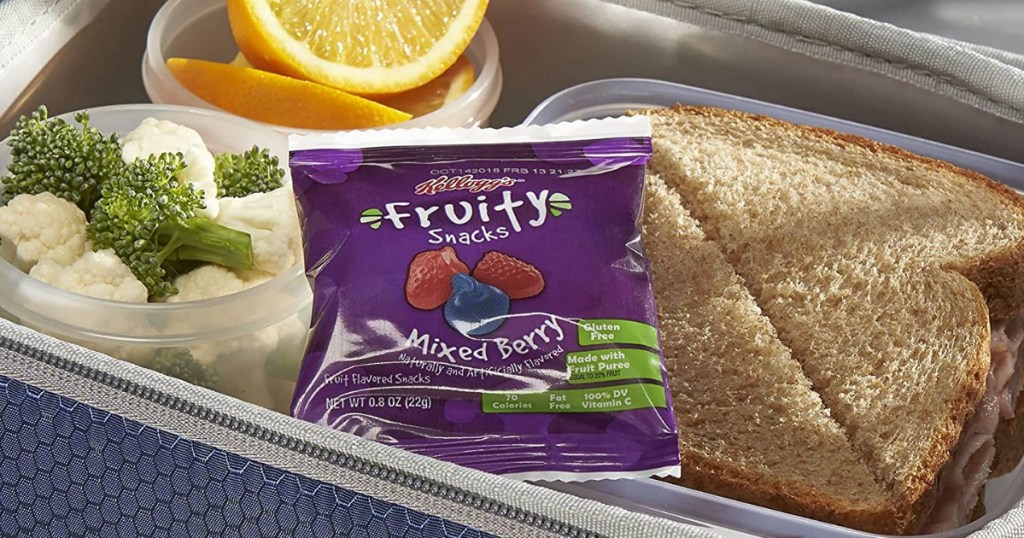 Kellogg's fruity snacks pack in lunchbox with sandwich, veggies and orange wedges