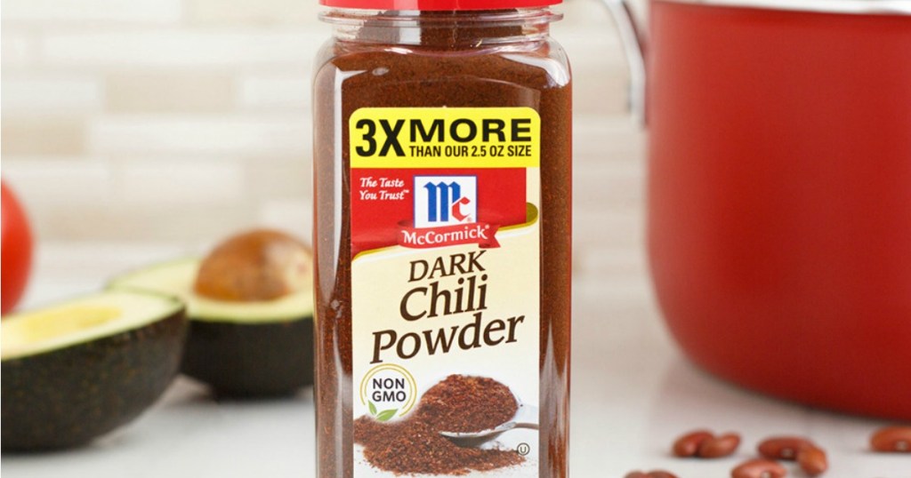 McCormick Dark Chili Powder in front of pan and avocado