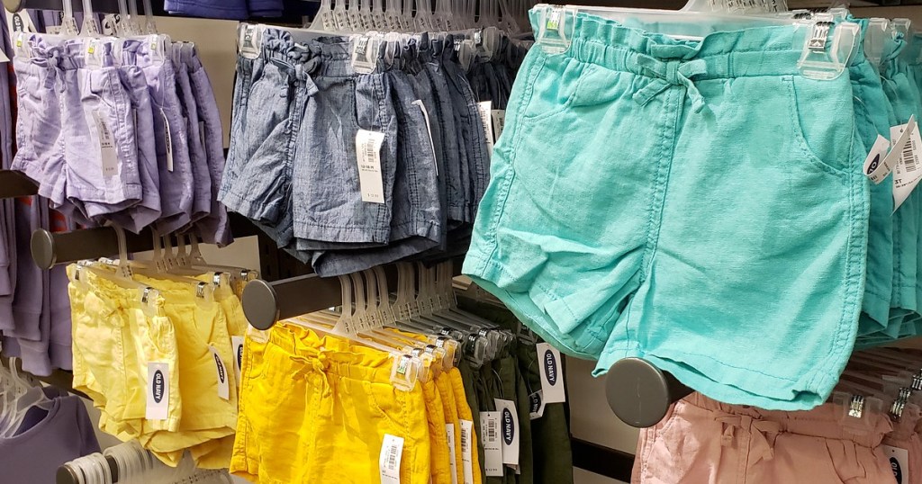store display racks of colorful pairs of toddler shorts with drawstring waistbands