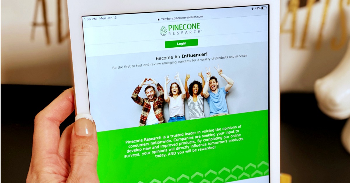 hand holding an ipad with Pinecone research on it