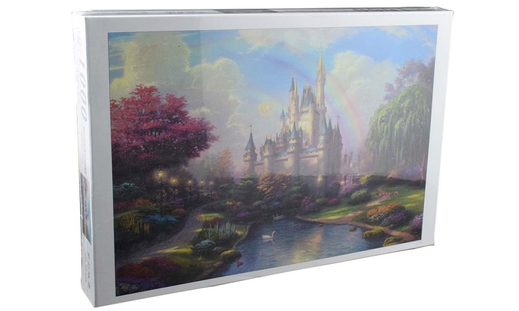 puzzle box with a photo of a fairy tale castle with rainbow over it