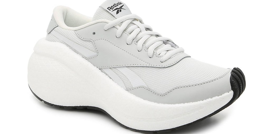 white and light grey reebok sneakers with large white platform sole