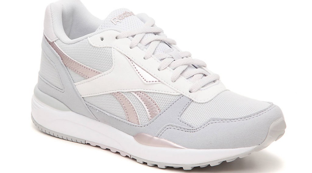 light grey sneakers with white and pink accents and white rubber soles