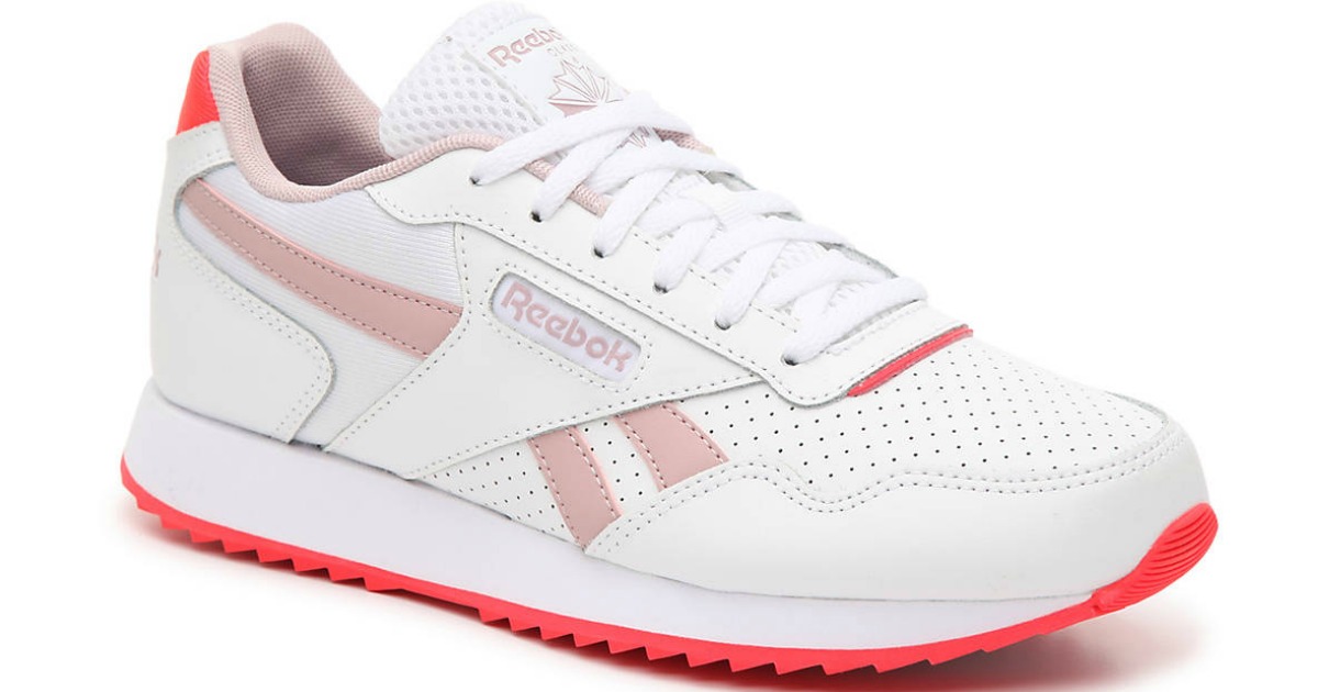 pink and white reebok sneaker