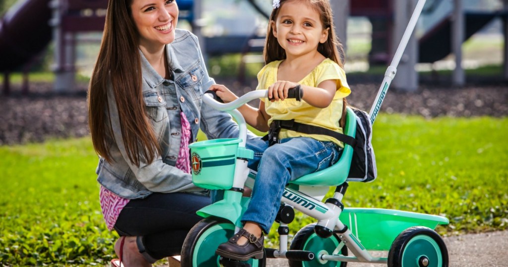 Little girl riding Schwinn Easy-Steer Tricycle