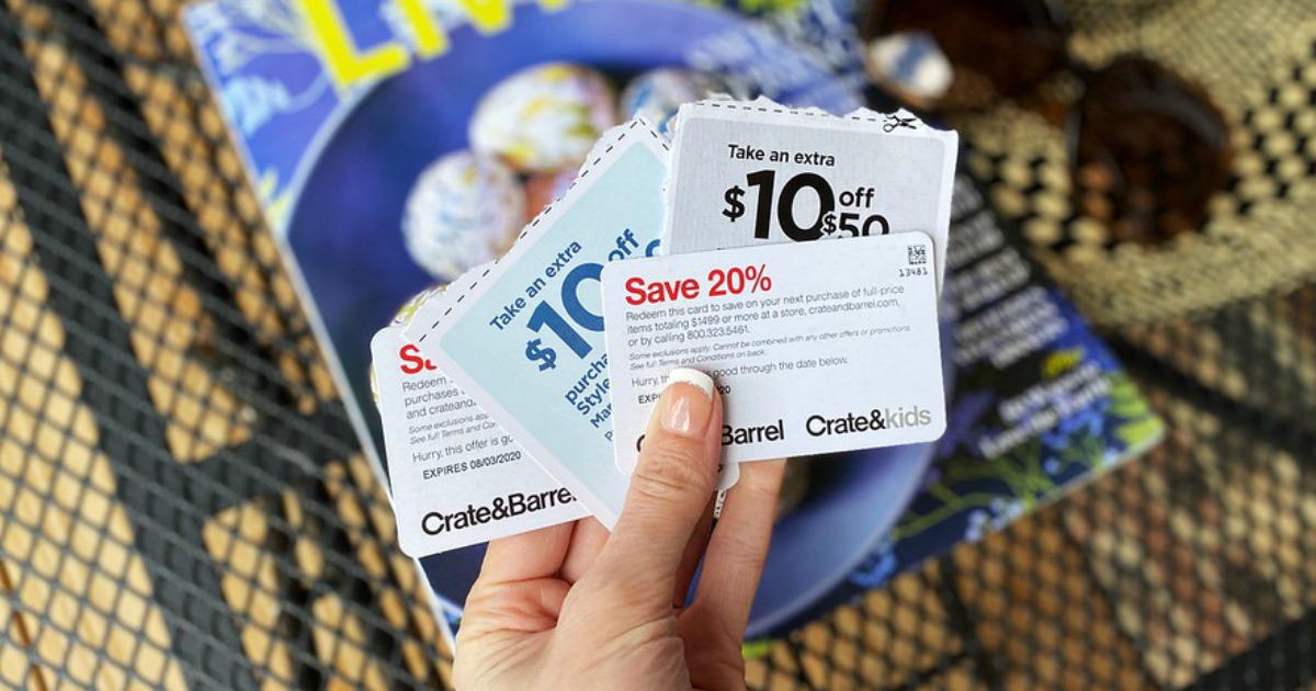 woman holding coupons in front of a magazine