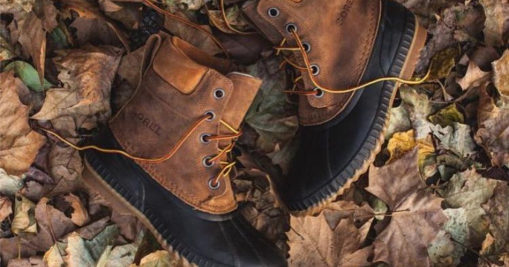 brand name winter boots laying in a pile of leaves for aesthetic photo quality