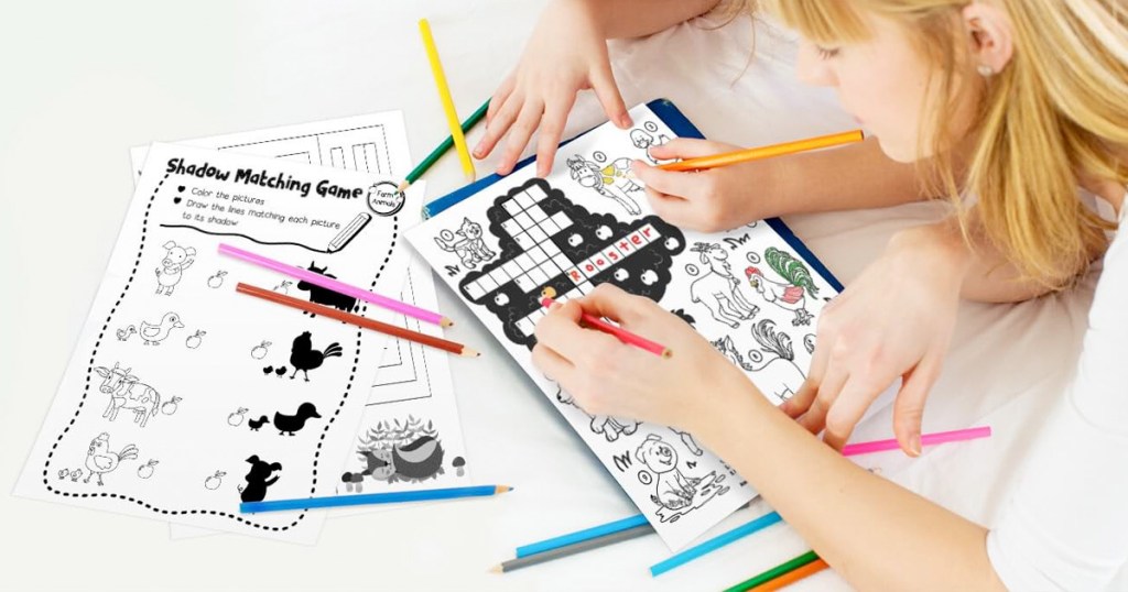 kids using colored pencils to color on coloring pages