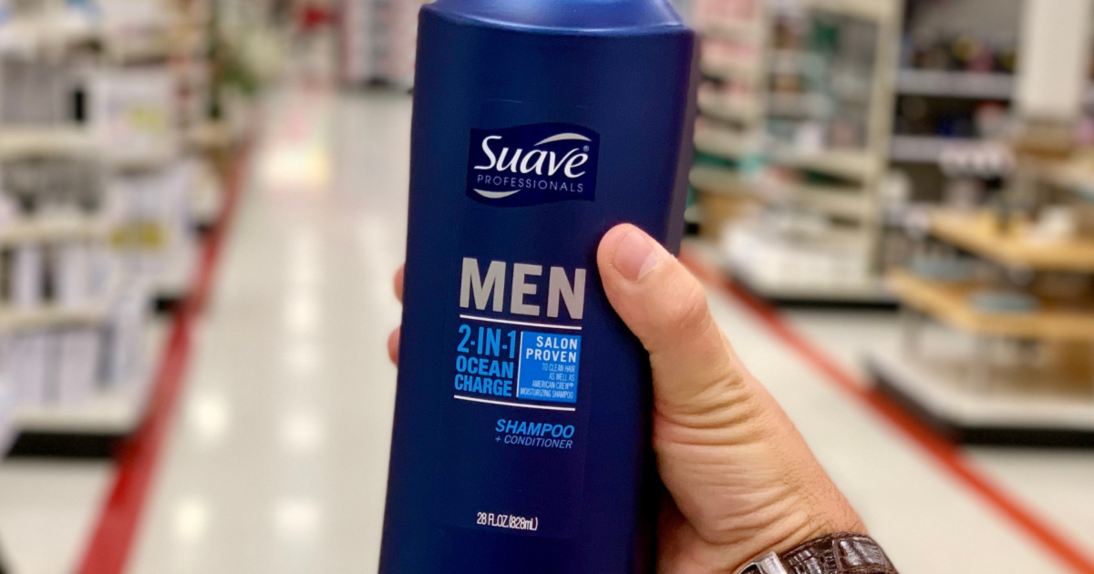 hand holding Suave shampoo and conditioner