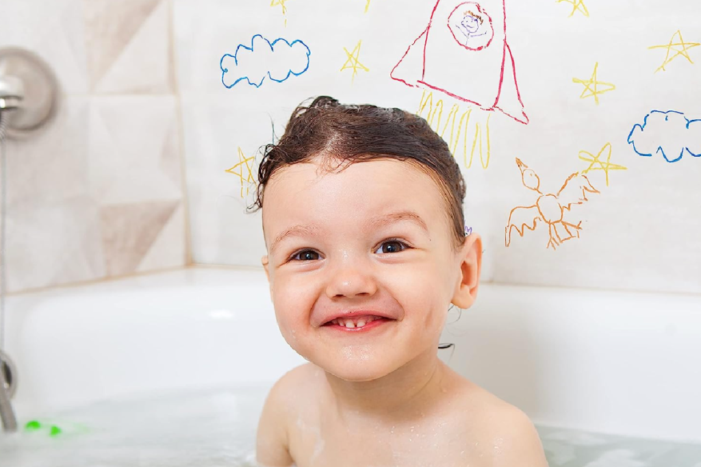 A child using bathtub crayons from Tub Works