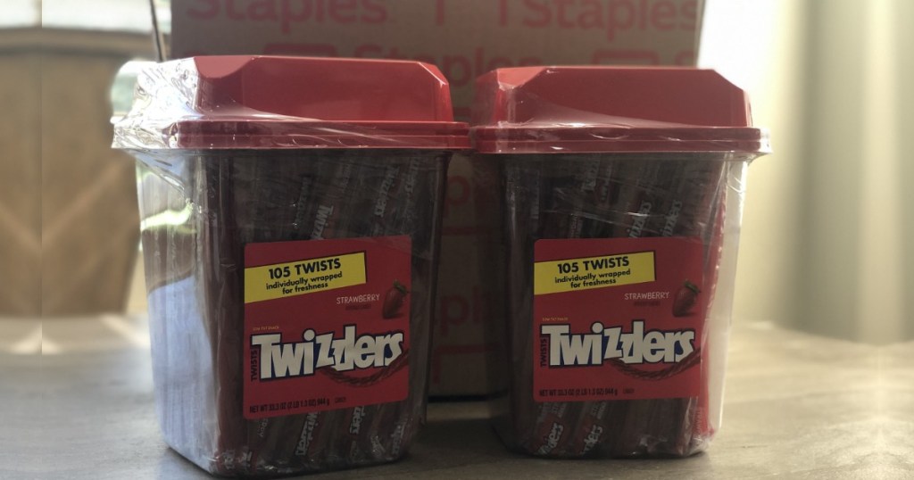2 tubs of Strawberry Twizzlers Twists Licorice on table
