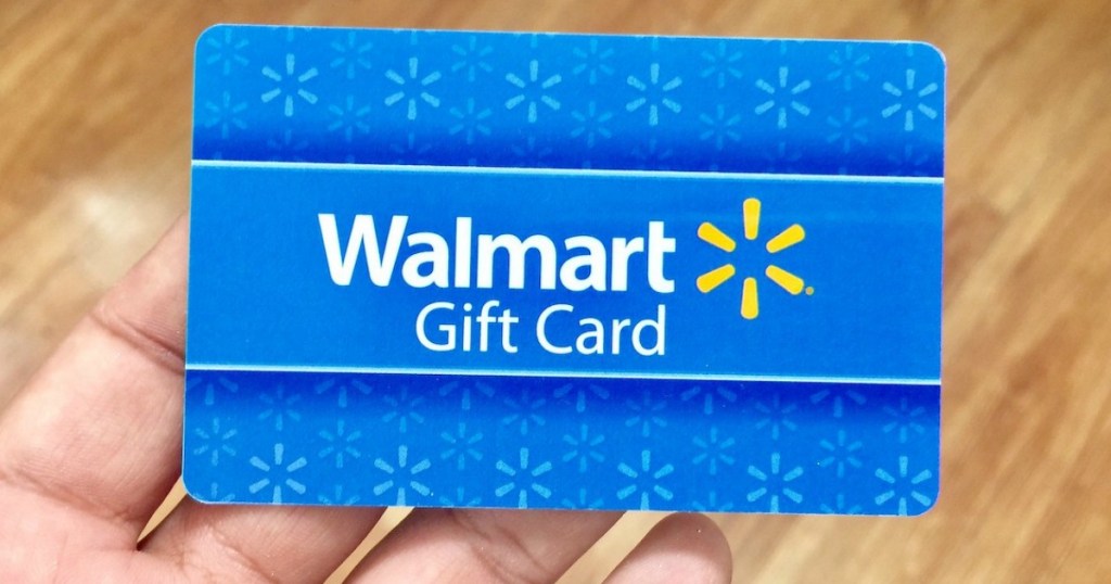 lady holding a Walmart gift card