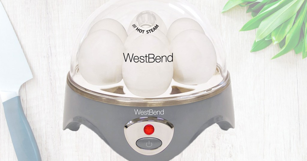 west bend brand electric egg cooker with grey base and clear plastic lid