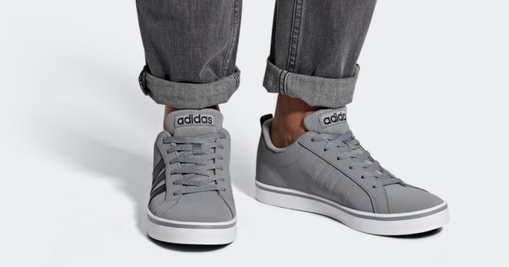 adidas mens vs pace shoes on feet man standing in jeans