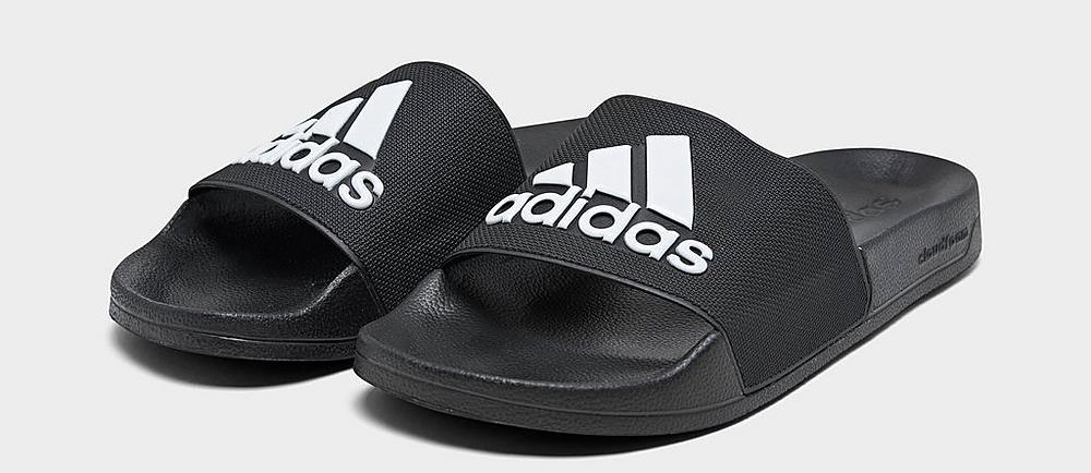 pair of black and white adidas sandals