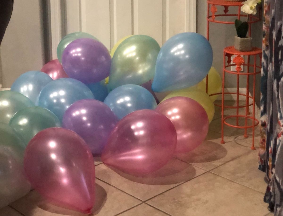 colorful balloons laying on the floor purchased at dollar tree online