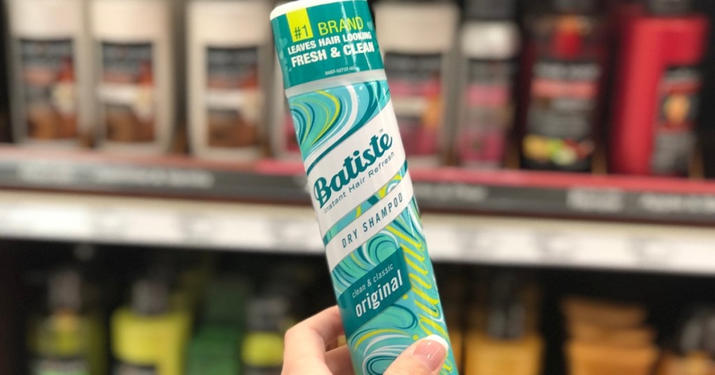 hand holding a can of Batiste Dry Shampoo