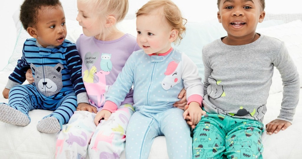 babies wearing footed pajamas