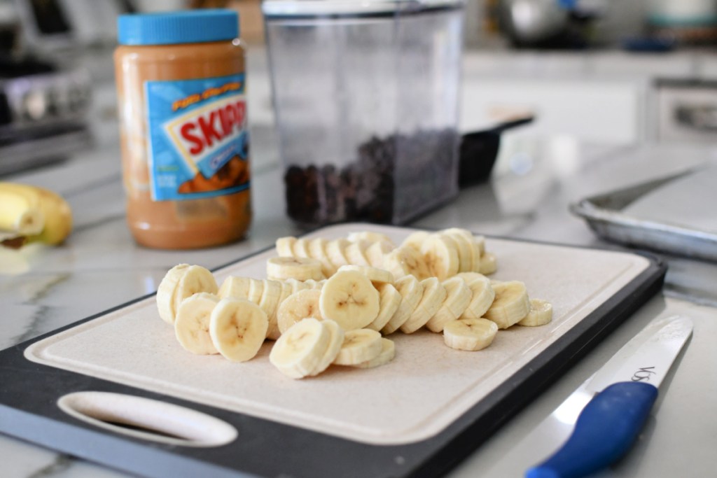 cutting bananas on a cutting board