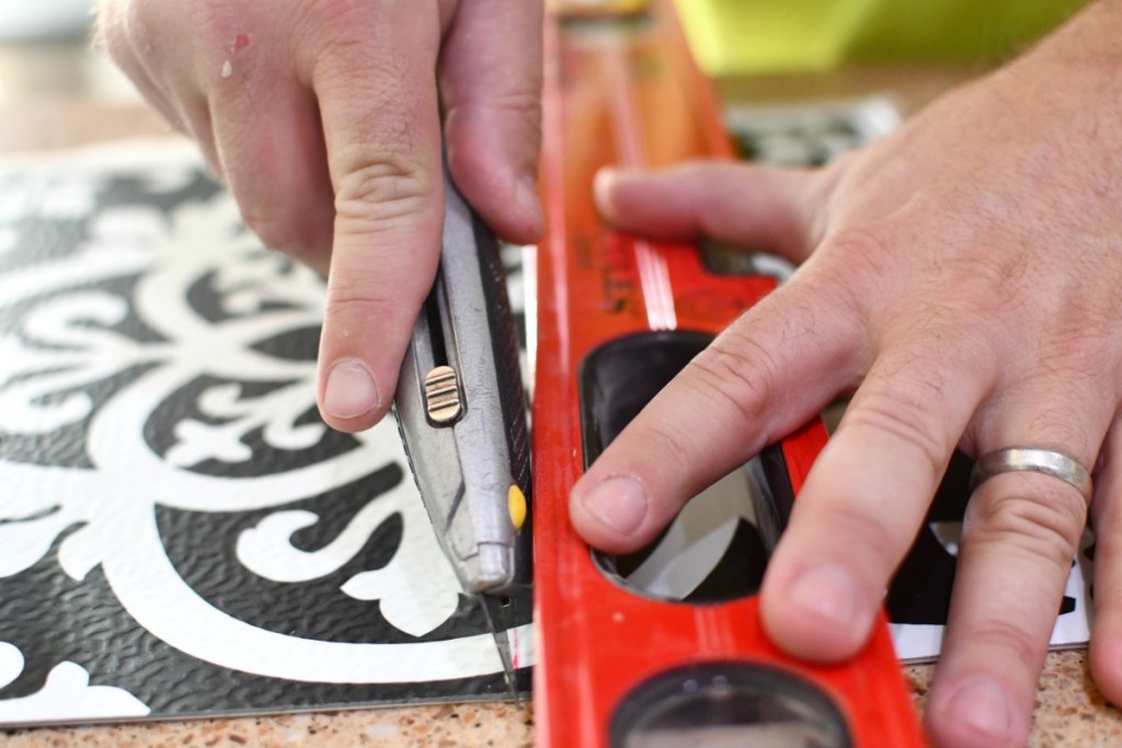 cutting peel and stick tiles