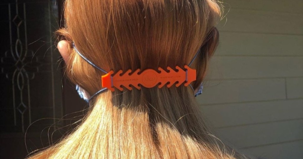 woman with red hair wearing orange Ear Savers