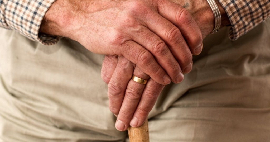 older gentleman holding cane