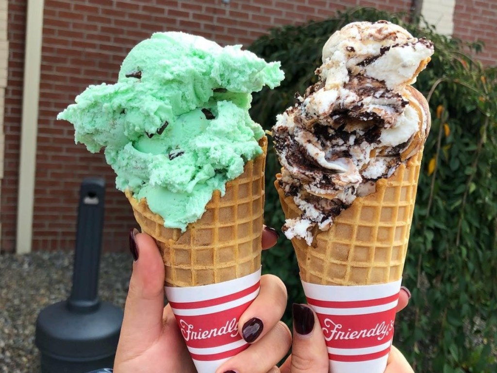 holding 2 ice cream cones from Friendly's