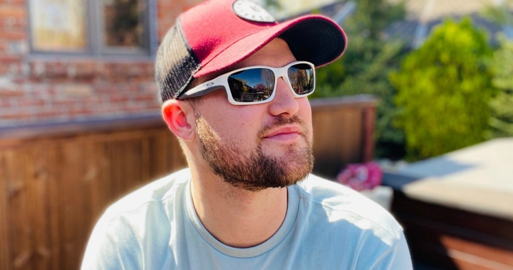 man wearing sunglasses sitting outside