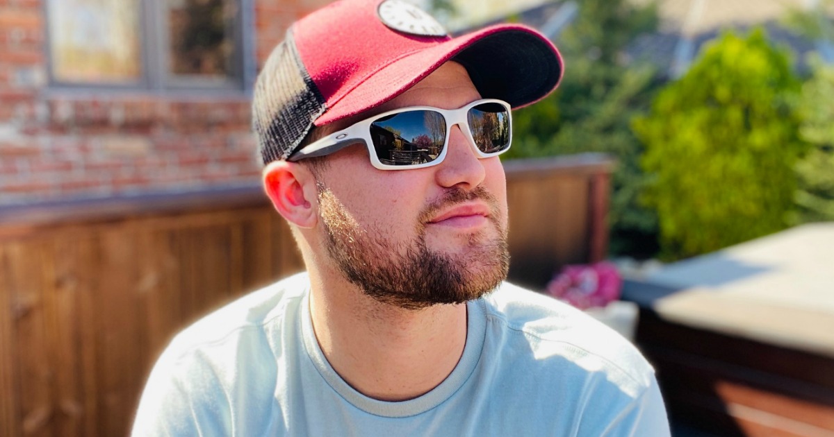 man wearing hat and Oakley sunglasses 