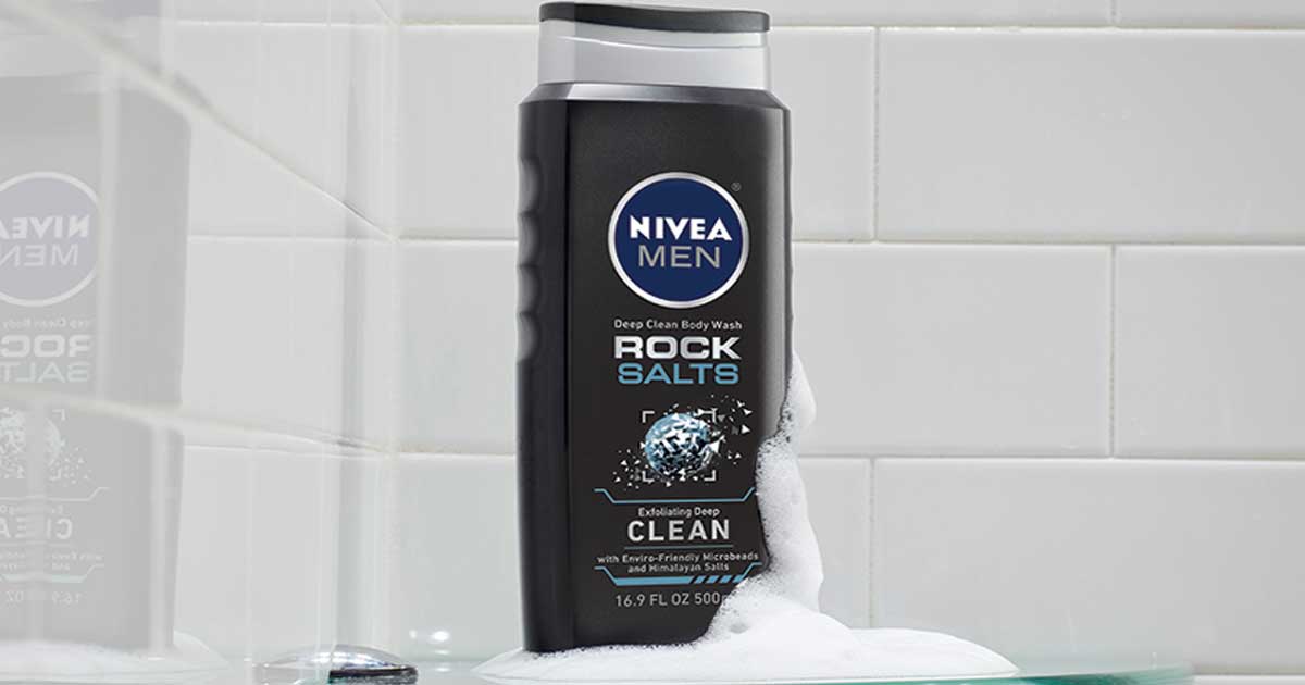 nivea men body wash bottle against a shower wall