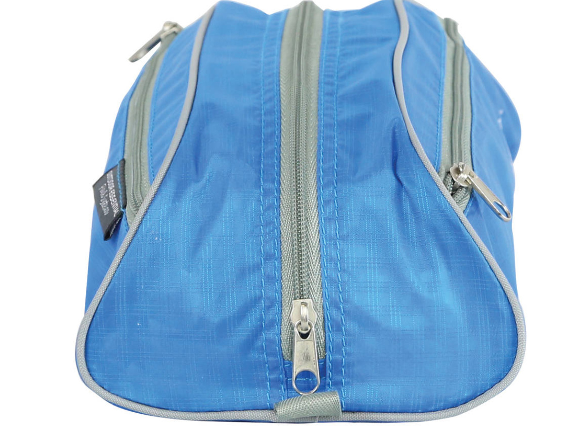 side view of blue ozark pack with zippered front and sides