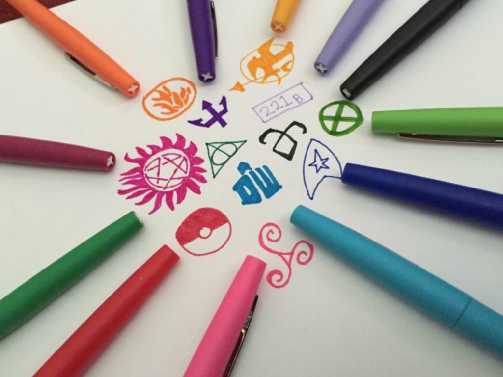 colorful pens in circle by drawings