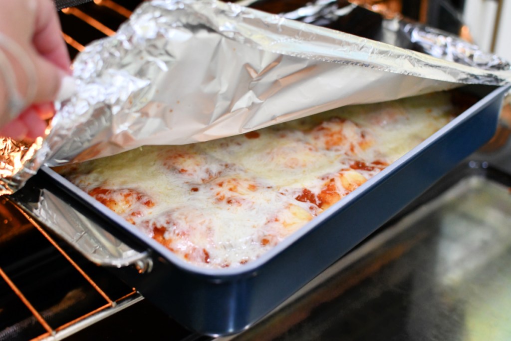 ravioli lasagna in the oven with foil