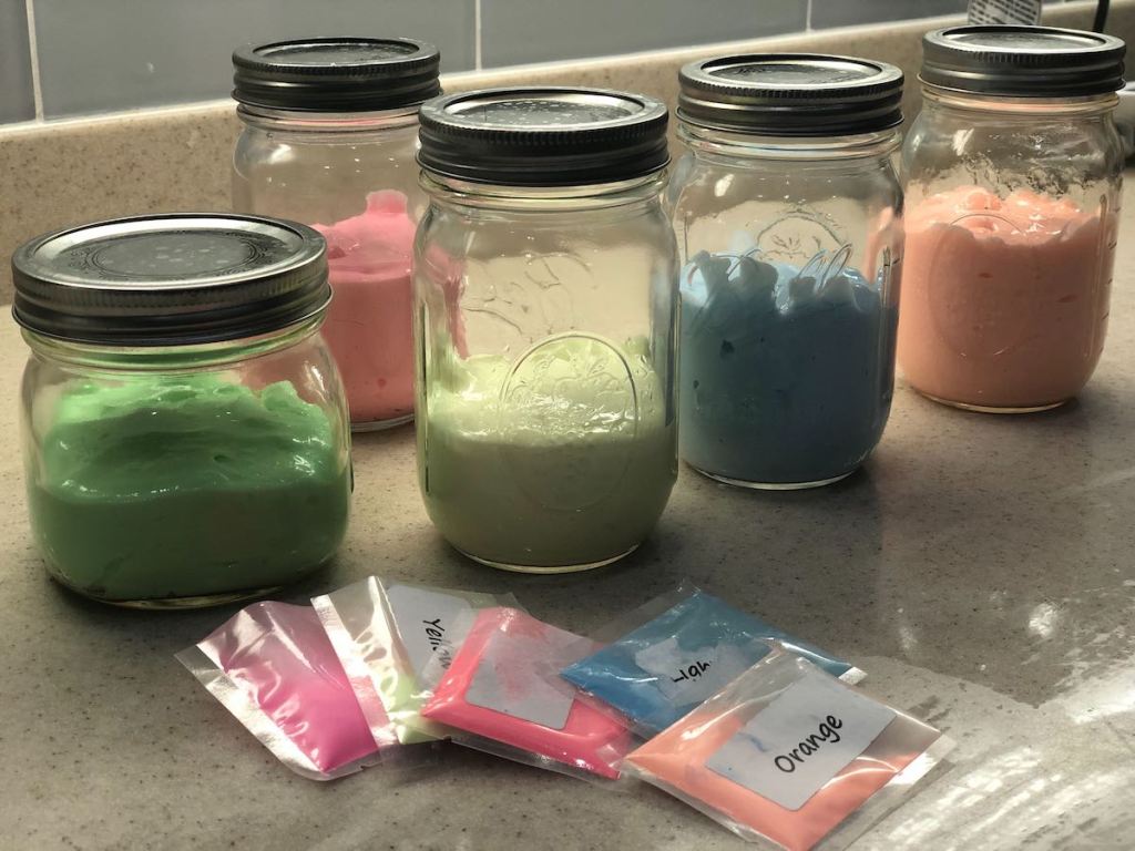 different colors in mason jars and plastic packets
