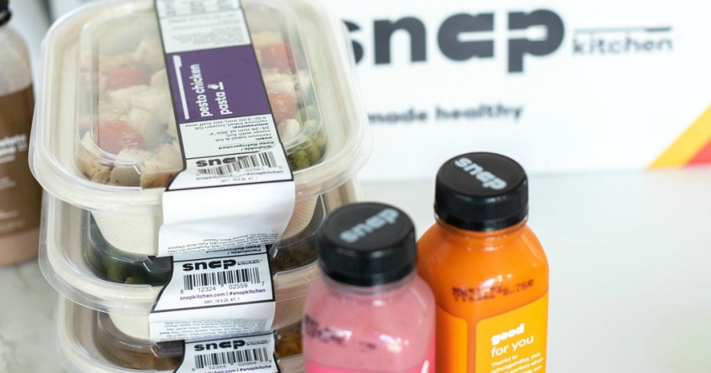 Snap Kitchen meals on counter with drinks 
