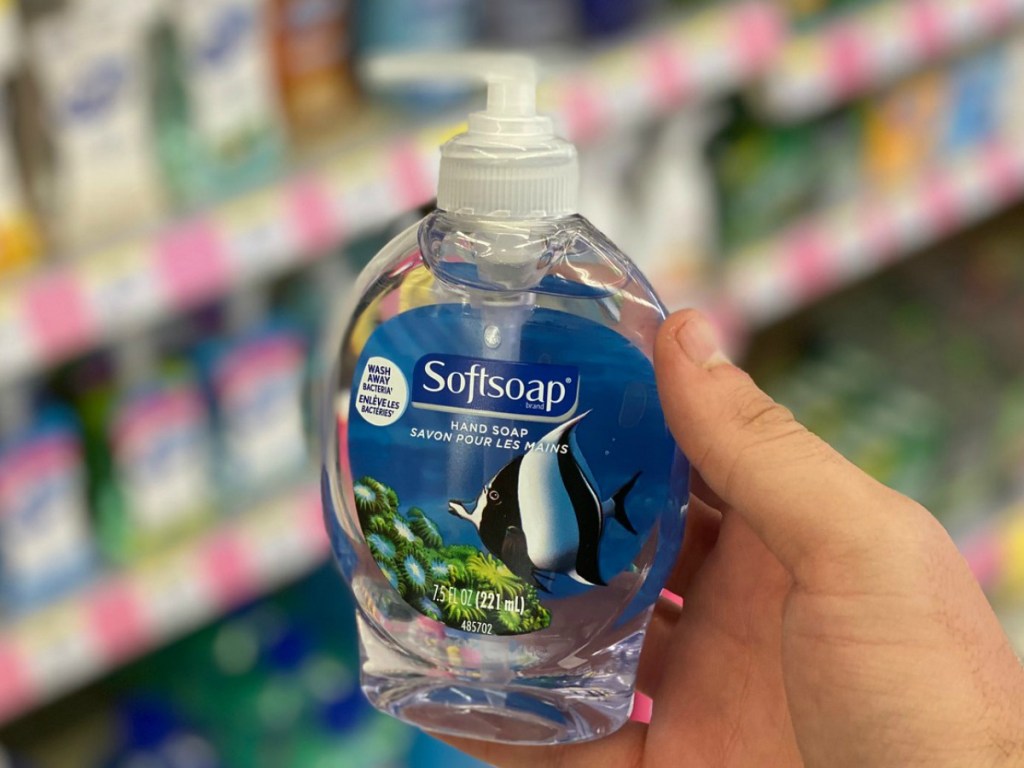 hand holding bottle of hand soap in store