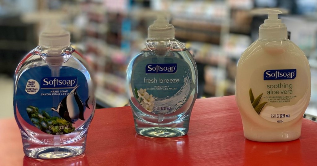 three bottles of hand soap on counter in store