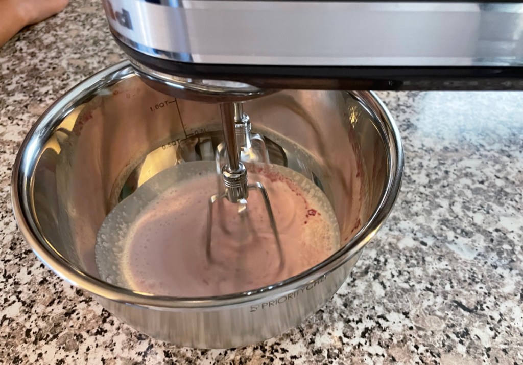using mixer to whip up strawberry nesquik whip