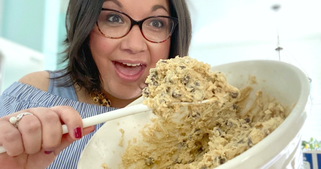 woman making cookie dough on a spoon