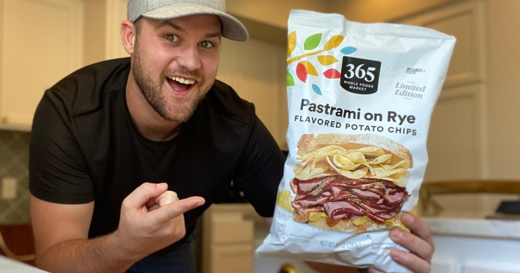 man holding bag of Pastrami on Rye potato chips