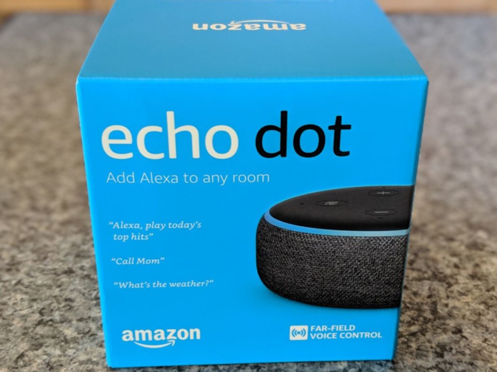 black round smart speaker in box on counter