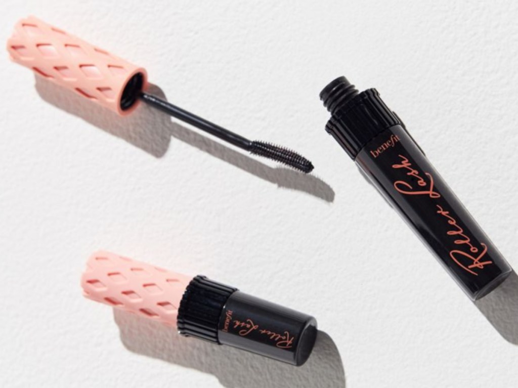 two black and pink bottles of mascara