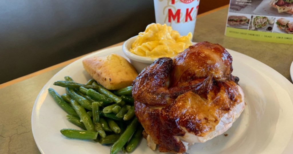 chicken, green beans, corn, mac and cheese on a plate next to a drink cup