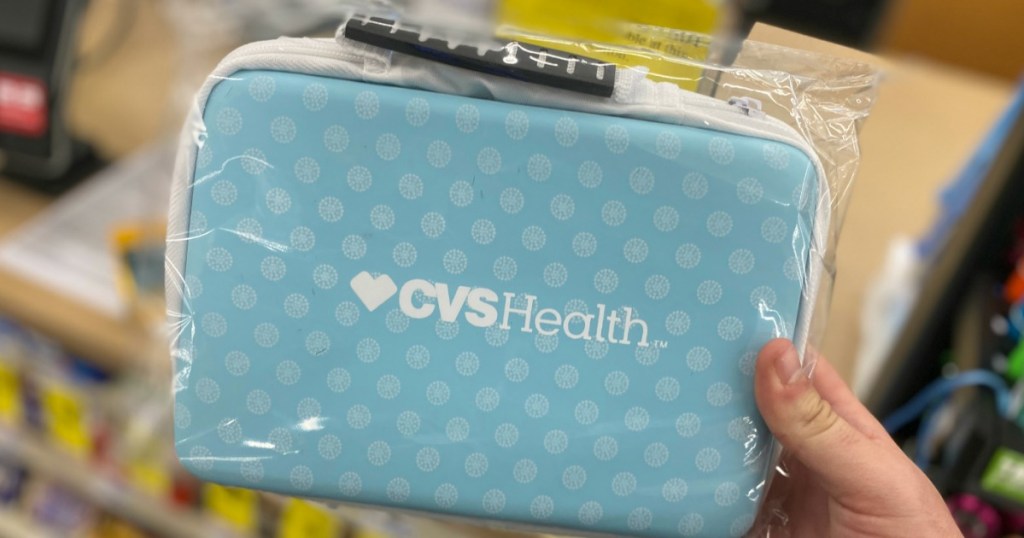 hand holding a CVS Health First Aid Bag