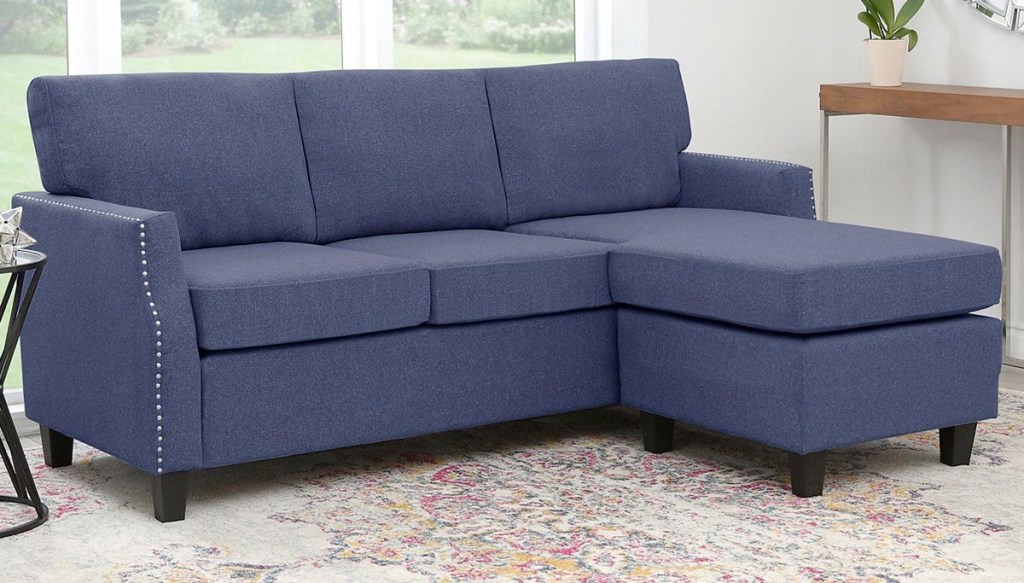 three piece navy colored sectional in living room