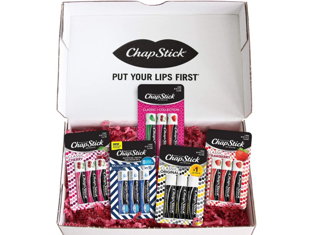 various flavored chapsticks in packages with pink confetti in shipping box