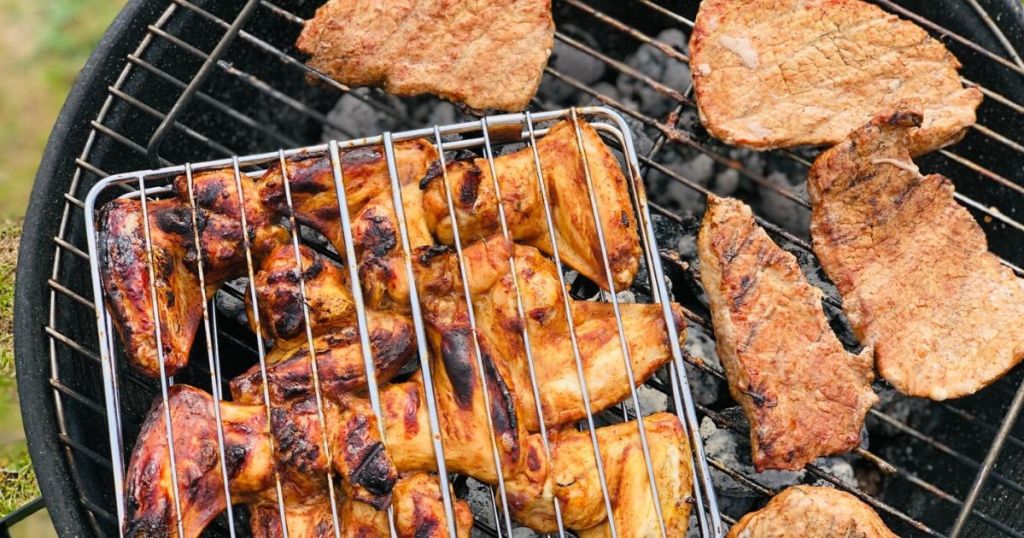 charcoal grill with chicken and pork 