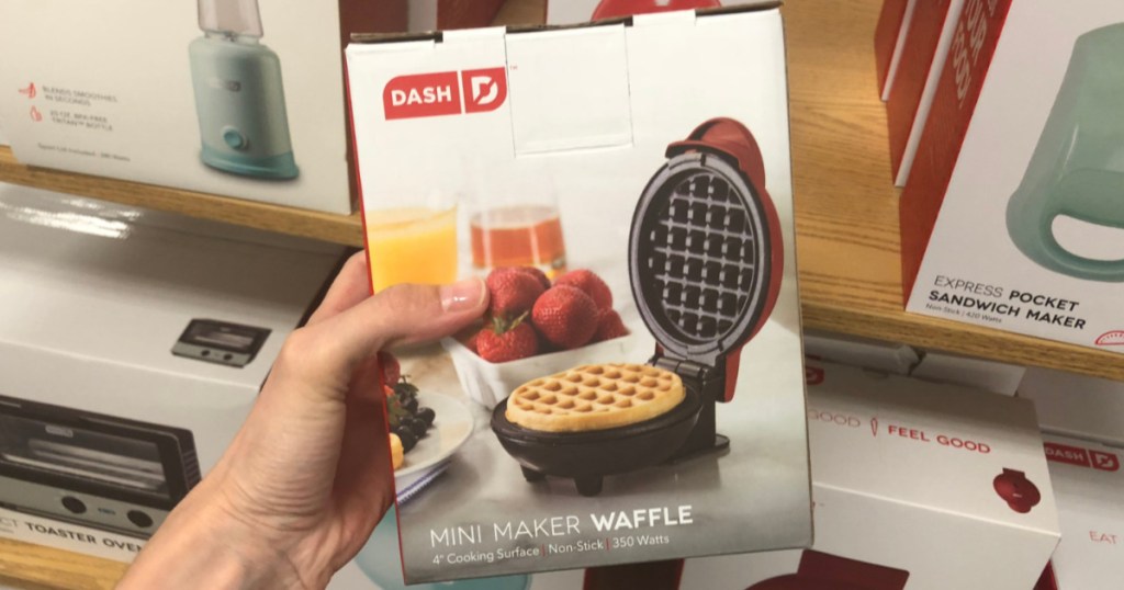hand holding boxed mini waffle maker in store