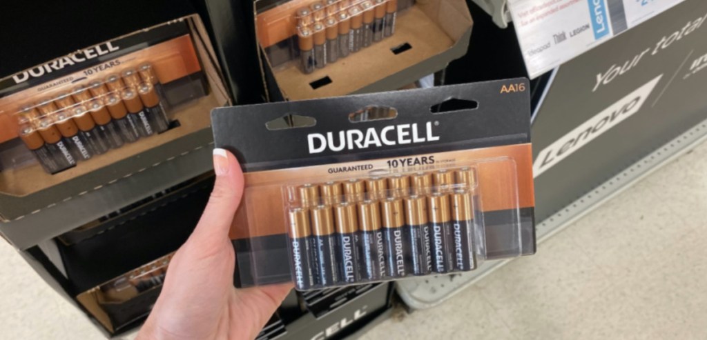 holding package of 16 Duracel batteries