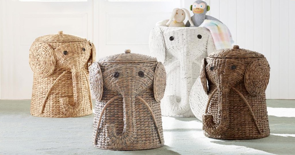 four elephant shaped wicker laundry hampers in room, and one filled with stuffed animals inside